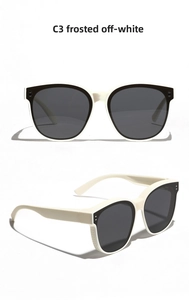 Detail of matte beige TR90 sunglasses with dark grey lenses and metal frame accents