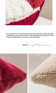Detail of red and white sherpa Christmas cushion cover with textured embroidery