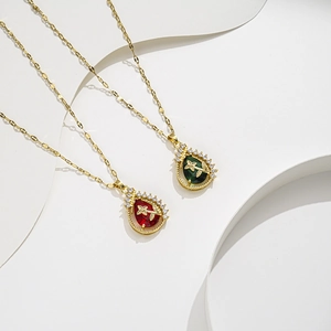 Gold titanium necklaces featuring red and green waterdrop pendants with zircon accents