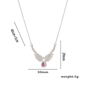 Silver angel wing necklace with moonstone teardrop pendant and crystal accents