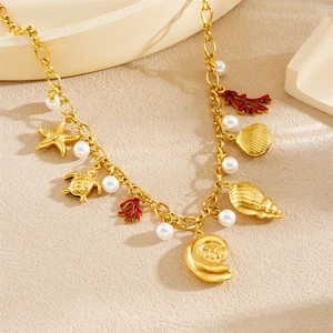 Gold-plated ocean theme necklace featuring starfish, coral, and shell charms on a gold chain