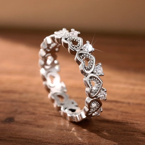 Macro view of sterling silver hollow heart ring with sparkling cubic zirconia stones