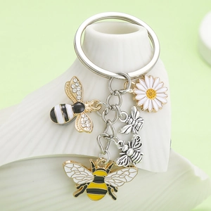 Enamel bee and daisy keychain with rhinestones on a gold metal ring for bags
