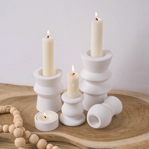 Minimalist white matte ceramic candle holder set with geometric cylinder design
