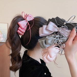 Elegant oversized satin bow hair clips with rhinestones and long tassels in various colors