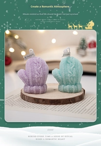 Detailed knitted pattern on purple and mint green glove-shaped scented candles