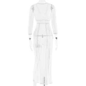 Detail of the white lace pattern and long sleeves on a semi-transparent elegant maxi dress