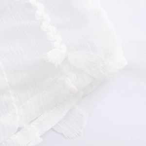 Elegant white lapel blouse with fringe tassels and high-quality woven fabric details