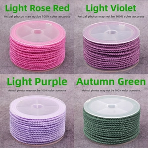 2mm braided jewelry cords in rose, lavender, purple, and green colors on plastic spools