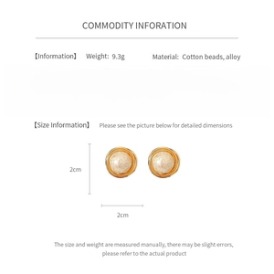Detailed view of gold plated cotton bead round earrings with weight and size specifications