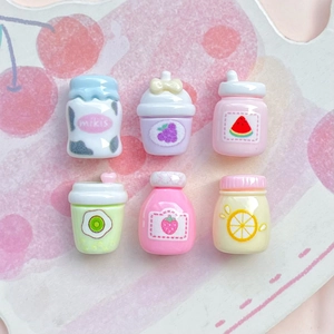 Set of six mini resin fruit juice bottles with colorful patterns on a cherry tray