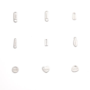 Detailed grid of stainless steel and K18 heart and oval jewelry tag pendants