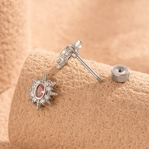 Silver starburst earrings with pink oval zircon center and micro-pave crystals