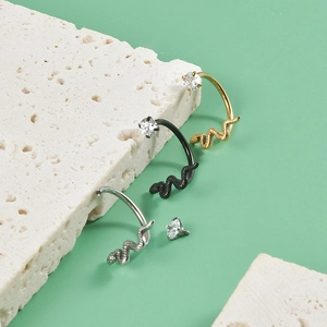Snake shaped stainless steel lip rings with cubic zirconia inlay in gold, black, and silver