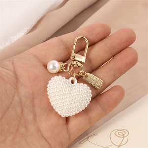 Golden heart pearl keychain with made with love tag accessory for bags and earphone cases
