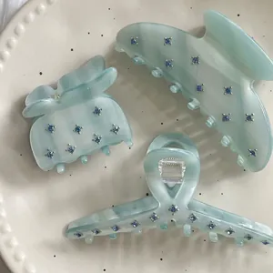 Three-piece light blue acetic acid hair claw clip set with sparkling blue rhinestones