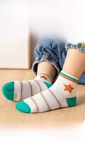 Detail of mesh cotton kids socks showing breathable knit and stars pattern