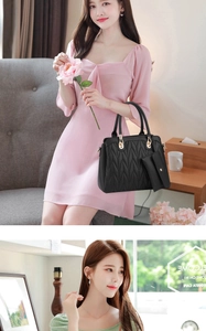 Detail der schwarzen Stepphandtasche mit Goldbeschlägen und passender Umschlagtasche
