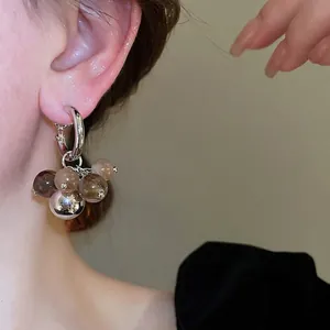Silver hoop earrings with gradient resin beads and metallic sphere in a stylish Y2K design