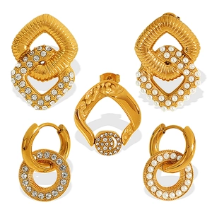 Elegant gold earrings set with pearls and zircons in geometric and hoop styles