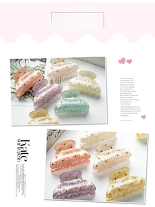 Detail of colorful marble pattern 6cm hair claws with crystals and elegant finish