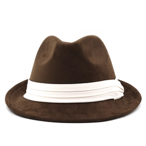 Detailed texture of brown suede fedora hat featuring a white pleated fabric decorative band