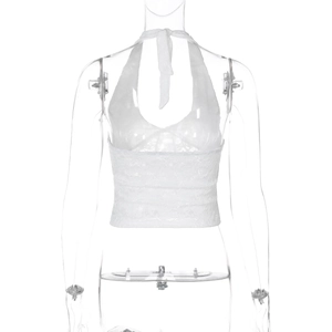 Detail of white lace halter crop top featuring intricate floral mesh and tie-up front design
