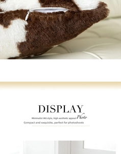 Close-up of fluffy cow print plush pillow cover with durable hidden zipper detail