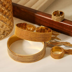 Polished stainless steel cuff bracelet and ring set with golden beaded texture design