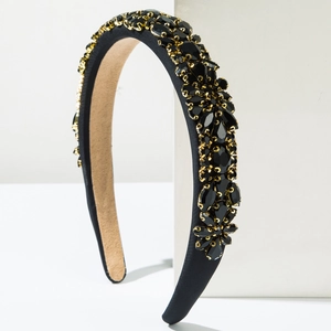 Serre-tête baroque de luxe orné de strass noirs étincelants et de griffes métalliques dorées