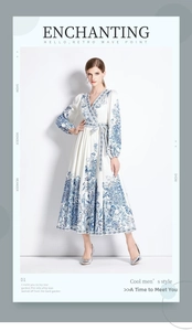 Close-up of V-neckline and vintage blue floral patterns on this elegant long sleeve maxi dress