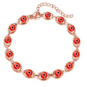 Detailed macro view of rose gold Evil Eye bracelet with red charms and lobster clasp
