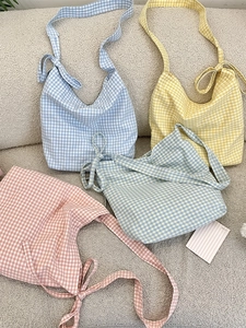 Spacious plaid canvas tote bags in assorted colors with adjustable bow straps for women