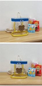 Detail of transparent PVC kids backpack with blue zipper and cute cartoon bear print