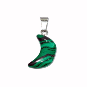 Detail shot of a crescent moon pendant made of green malachite stone with a silver clasp