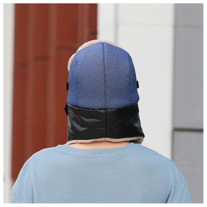 Back view of a thermal winter trapper hat with blue denim top and white faux fur lining