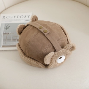 Close-up of brown bear ear aviator hat with soft faux suede and warm sherpa lining