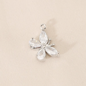 Macro shot of silver butterfly pendant with marquise-cut zircons for DIY jewelry making