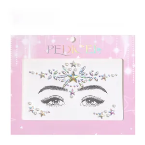 Detail of aurora star and pearl face jewels on decorative packaging for party makeup