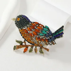 Vintage large crystal magpie bird brooch in antique gold finish for suit jackets