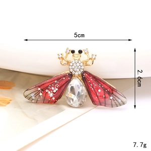 Detailed macro shot of a jewel-encrusted bee brooch with dimensions 5cm x 2.6cm