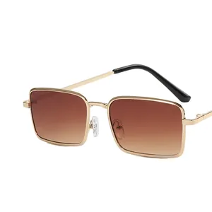 Retro small square metal sunglasses with gold frame and brown gradient lenses