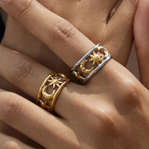 Classic celestial 18K gold plated stainless steel sun and moon cutout rings worn on hand