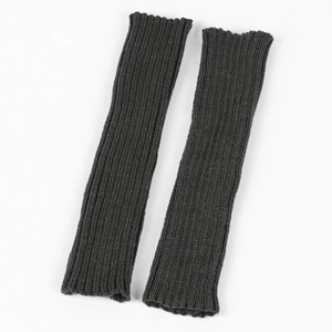 Close-up of charcoal grey ribbed knit arm warmers with detailed vertical stripe texture