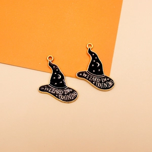 Detail view of black enamel wizard hat charm with Wizard in Training gold lettering