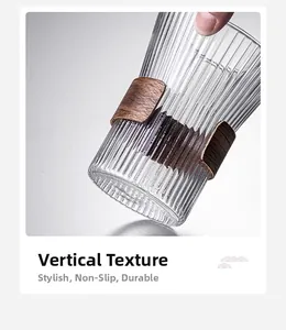 Detailed close-up of vertical ribbed glass texture with walnut wood heat insulation sleeve