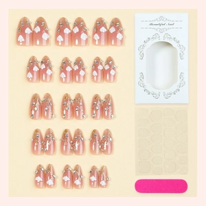Set unghie finte a mandorla con sfumatura rosa, fiori bianchi e strass in confezione regalo