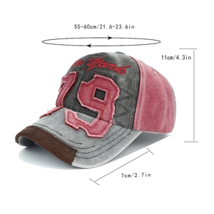Detail of vintage denim baseball cap with 3D embroidery and distressed brim textures