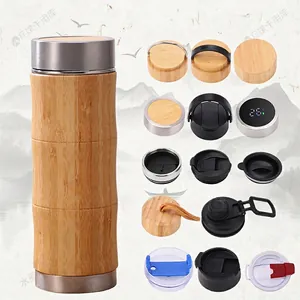 Insulated stainless steel water bottle with natural bamboo shell and 15 optional lid types