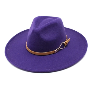 Detail of purple wide brim fedora with brown leather band and gold buckle accent